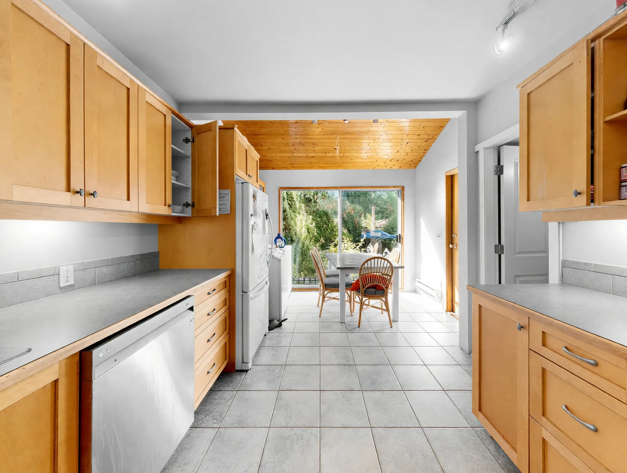 The kitchen looking toward the breakfast area and the door to the back deck